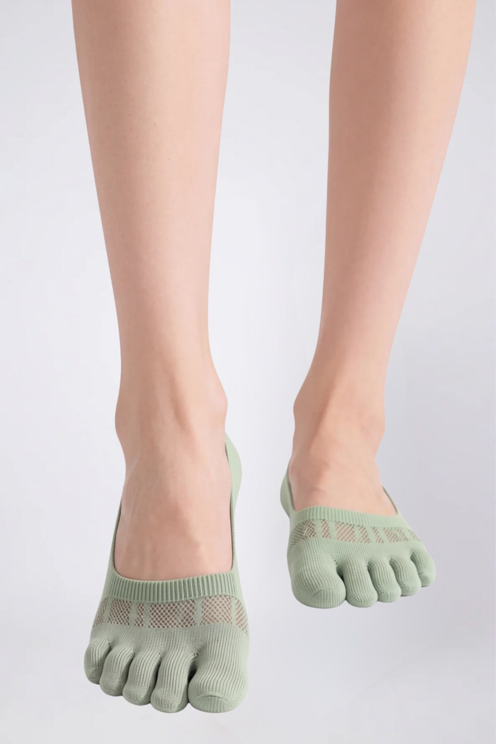 Model wearing lyocell five-toe no-show stockings in green