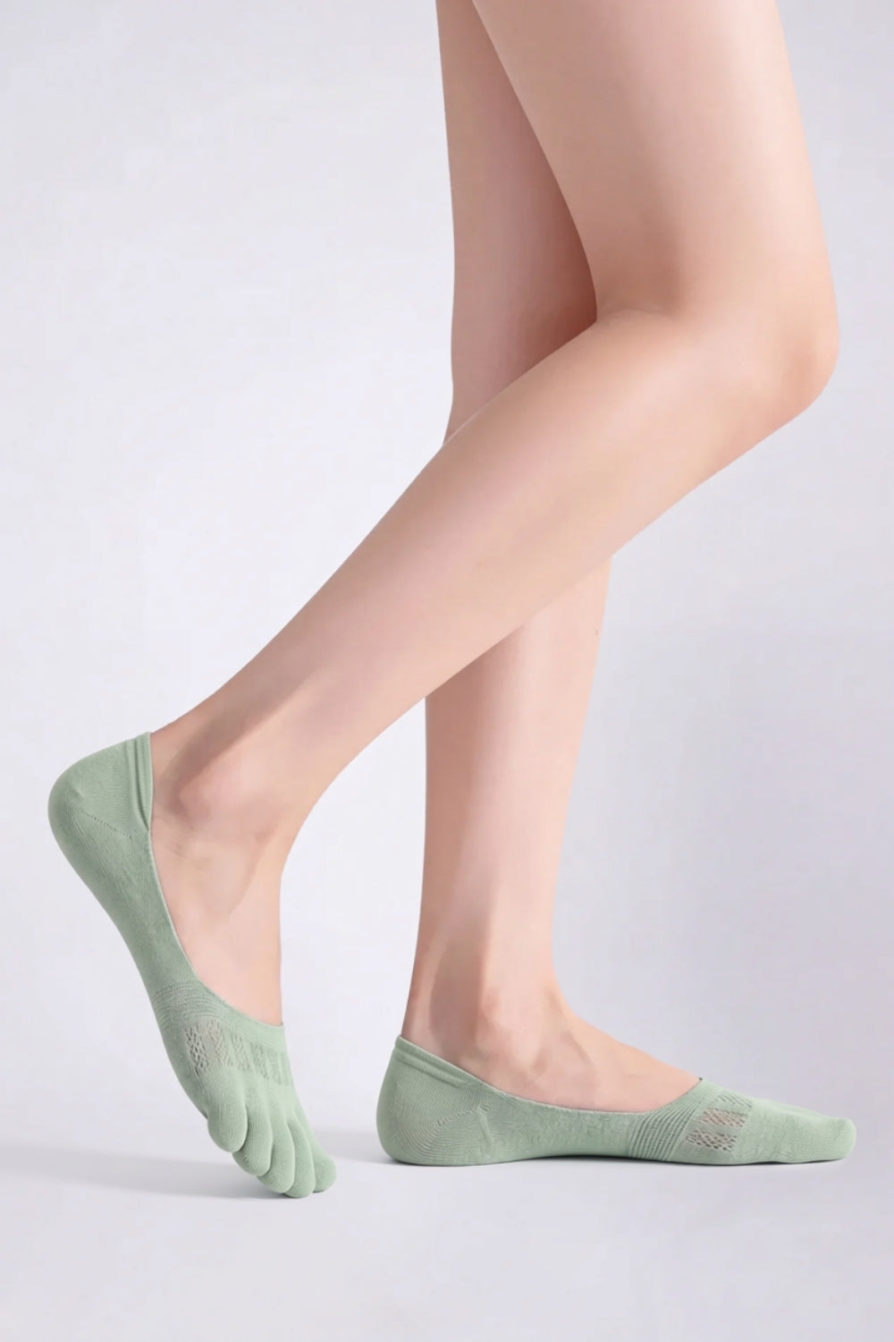 Model wearing lyocell five-toe no-show stockings in green, alternate view