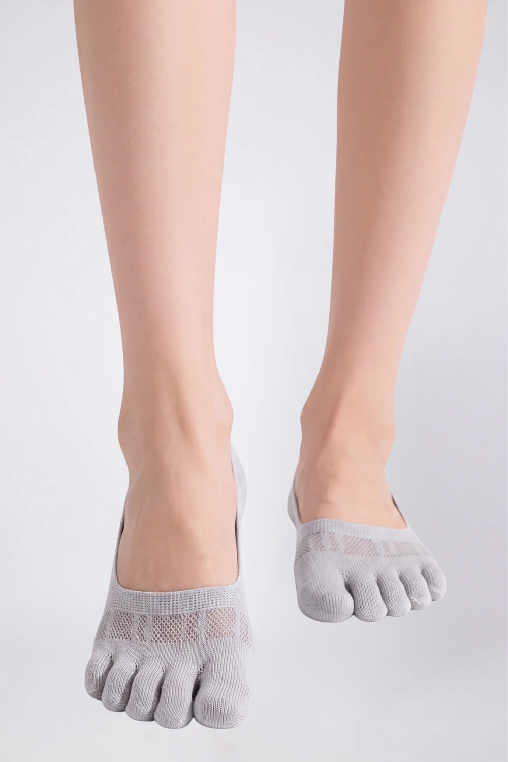 Model wearing lyocell five-toe no-show stockings in grey
