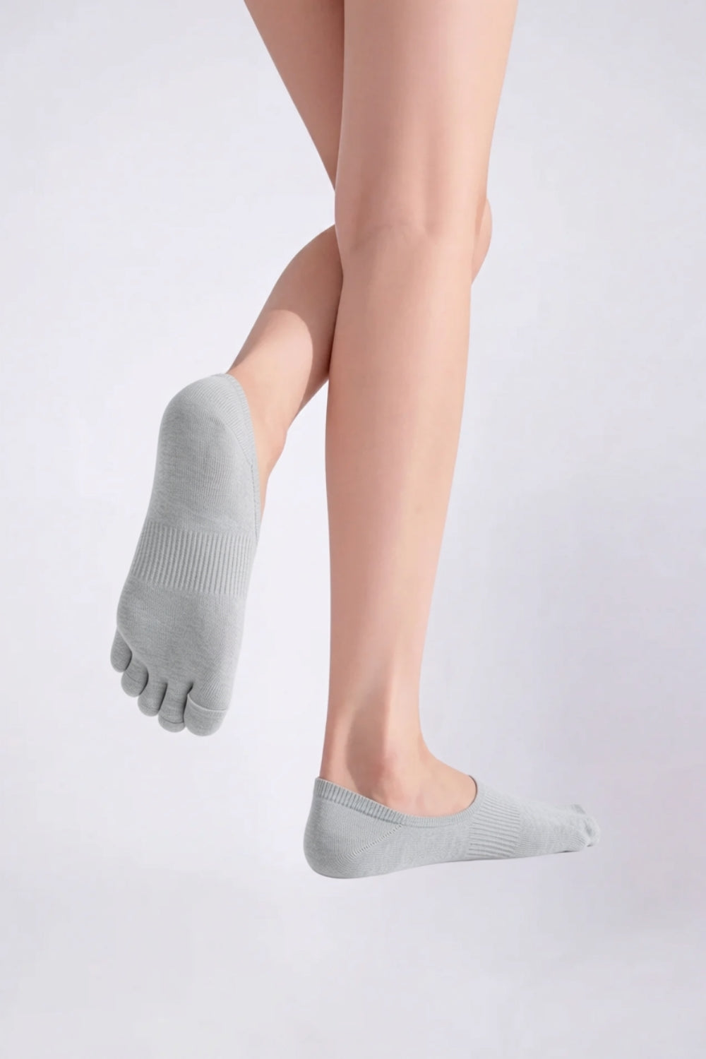 Model wearing lyocell five-toe no-show stockings in grey, alternate view