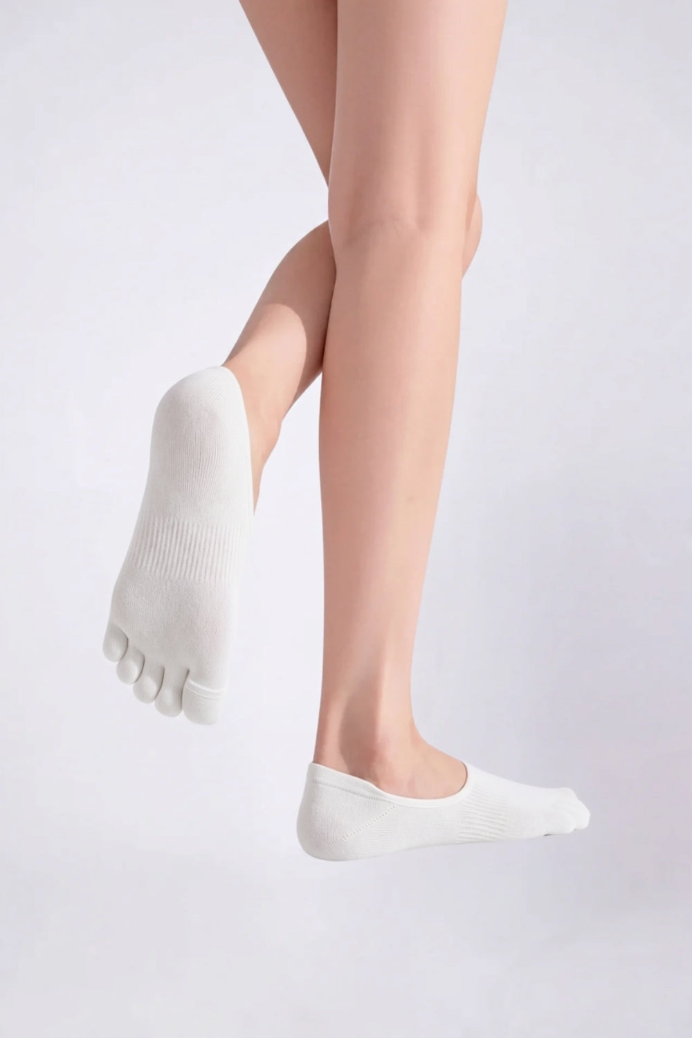 Model wearing lyocell five-toe no-show stockings in white, alternate view
