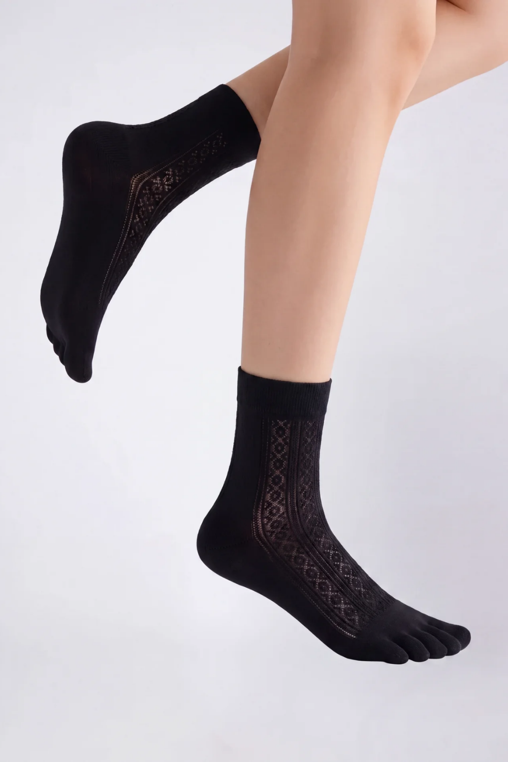 Model wearing openwork five-toe ankle stockings in black, alternate view