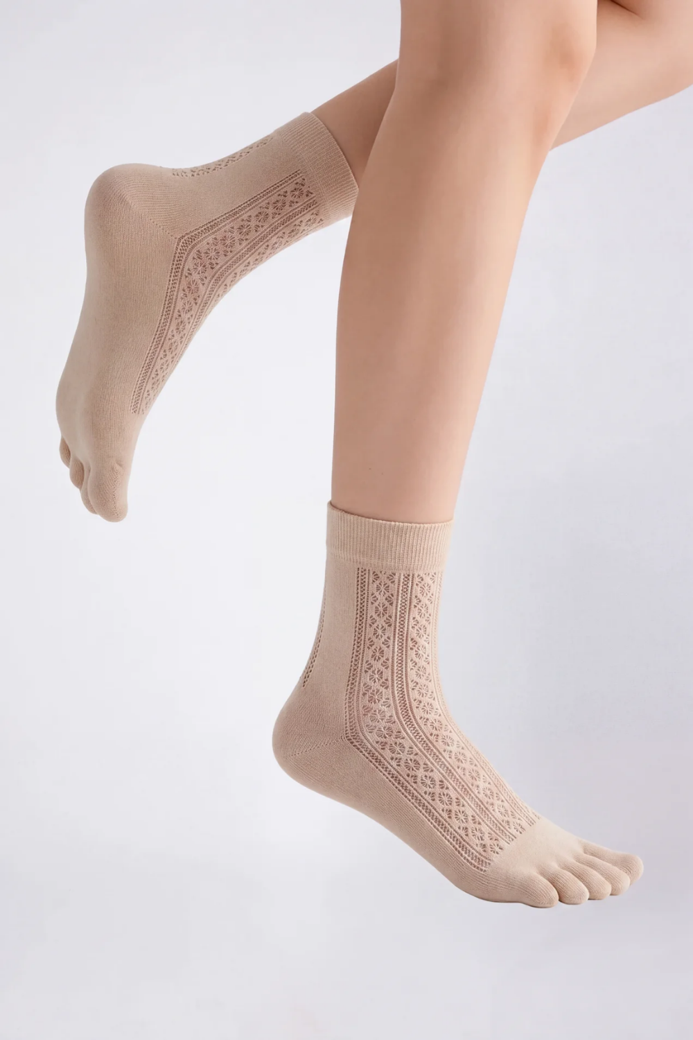 Model wearing openwork five-toe ankle stockings in nude, alternate view