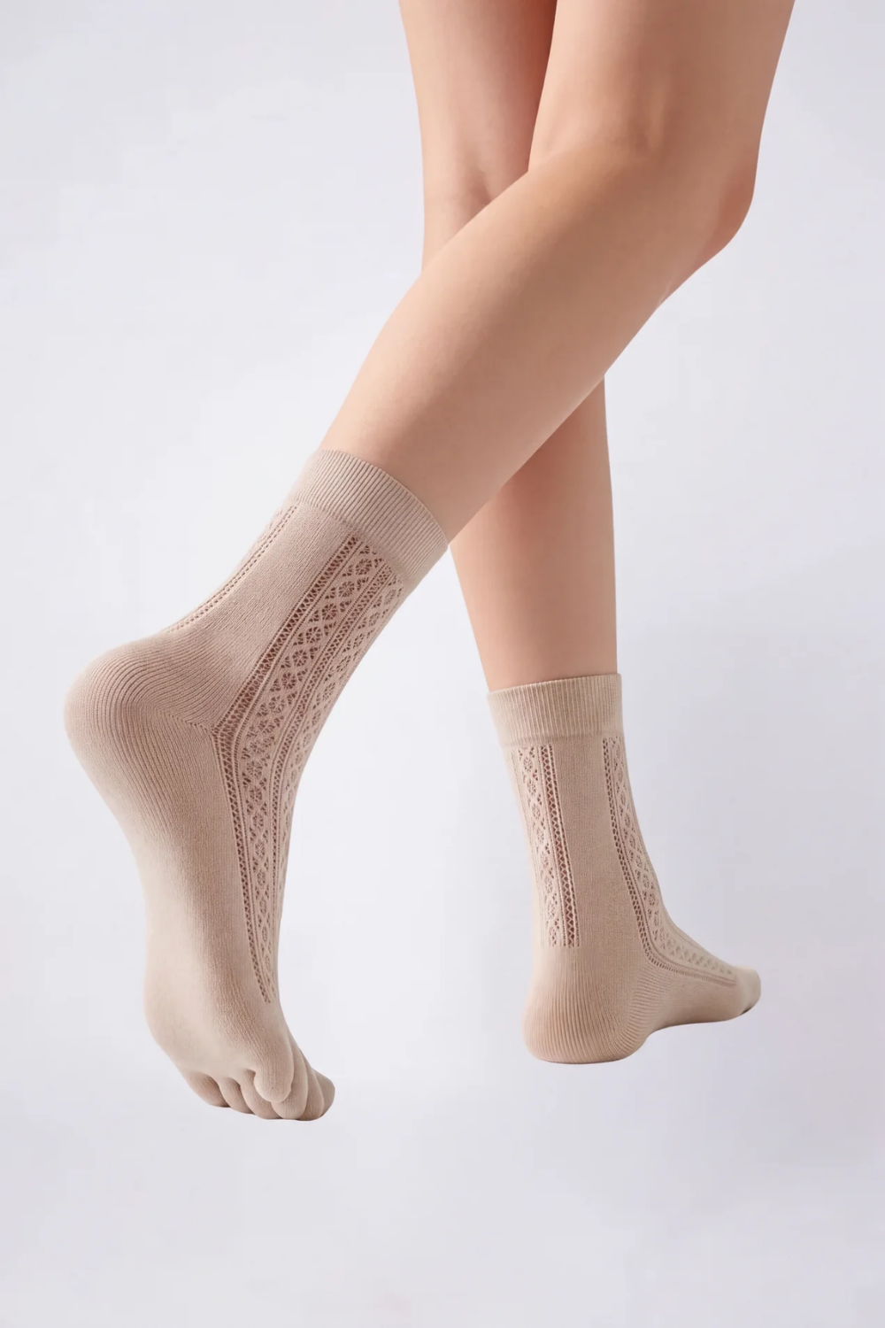 Model wearing openwork five-toe ankle stockings in nude, alternate view