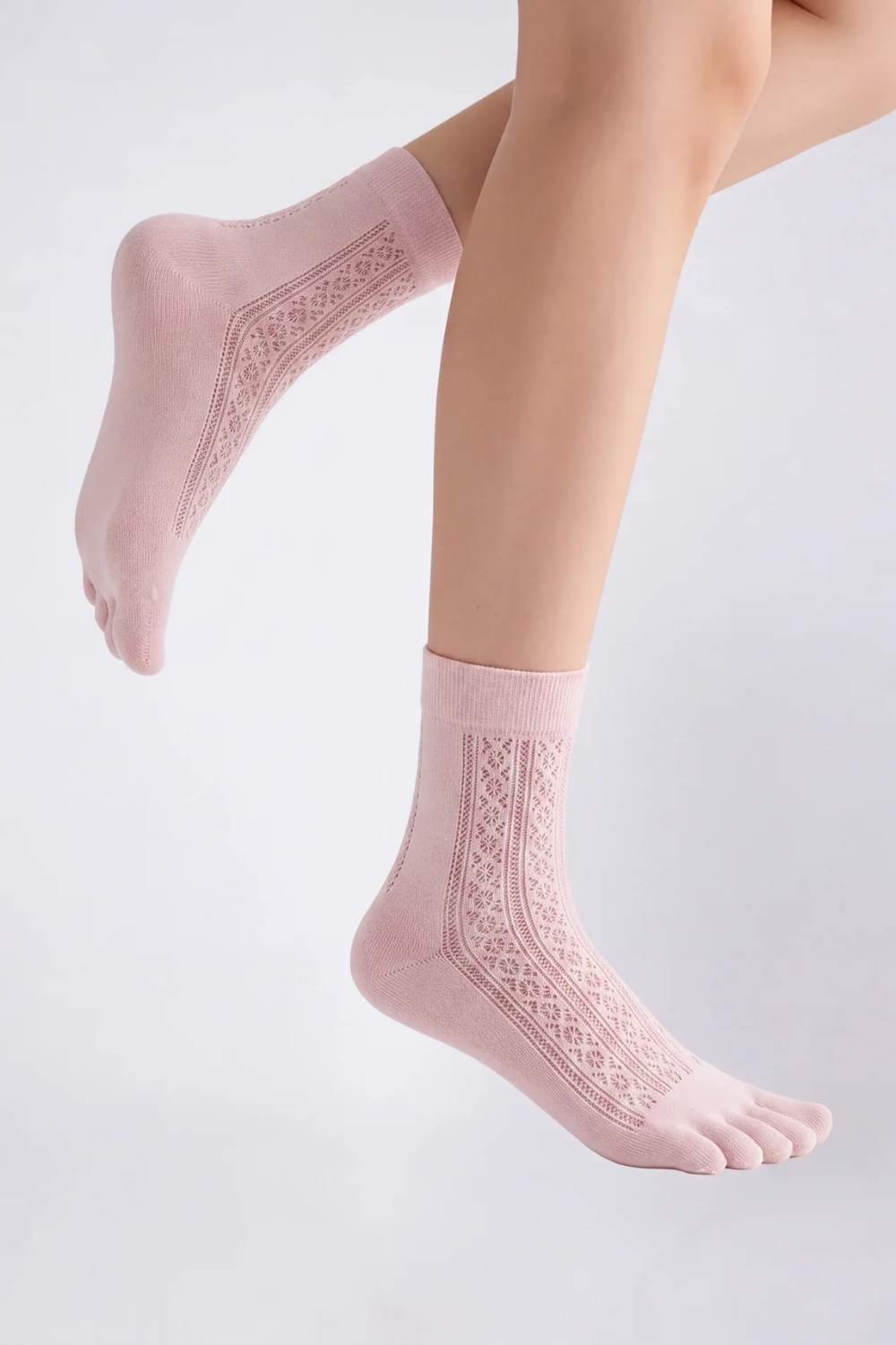 Model wearing openwork five-toe ankle stockings in pink, alternate view
