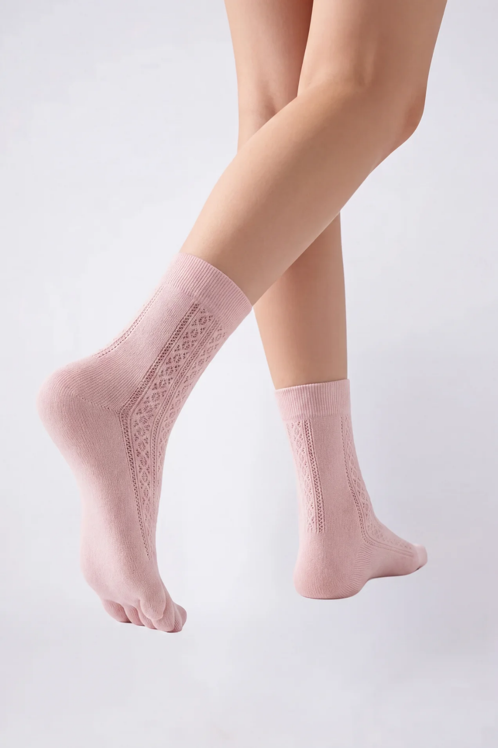Model wearing openwork five-toe ankle stockings in pink, alternate view