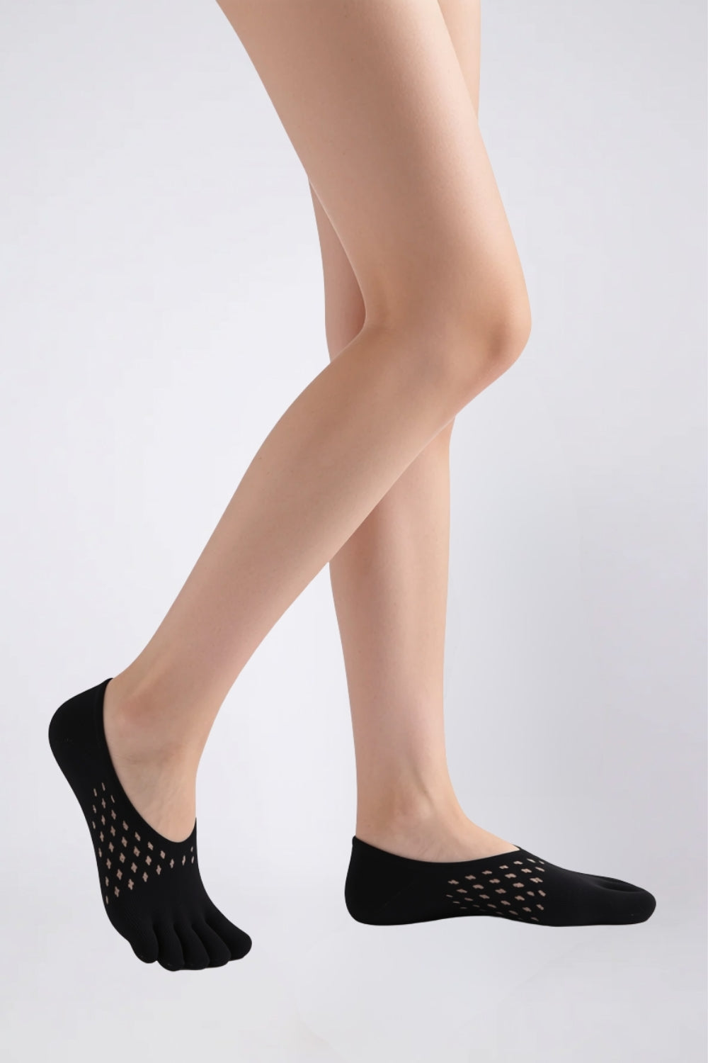Model wearing openwork five-toe no-show stockings in black, alternate view