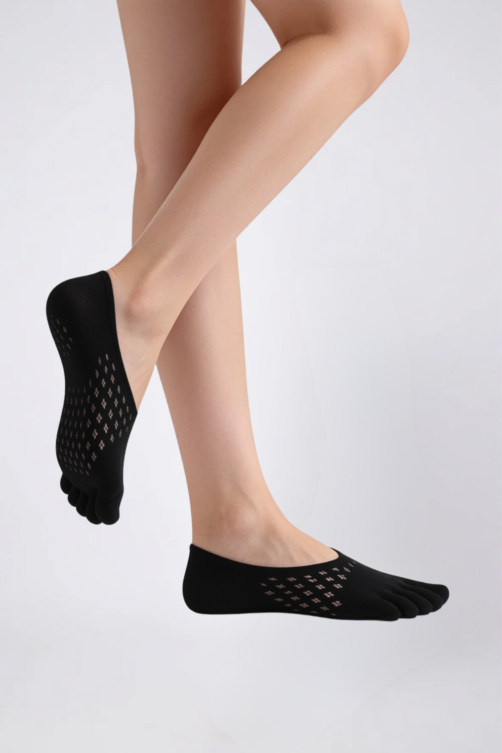 Model wearing openwork five-toe no-show stockings in black, alternate view