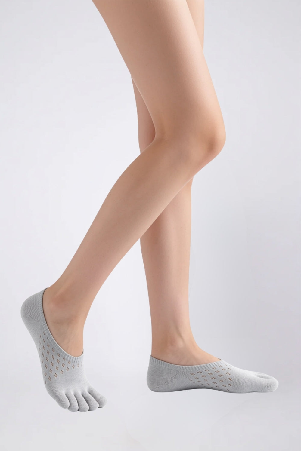 Model wearing openwork five-toe no-show stockings in grey, alternate view