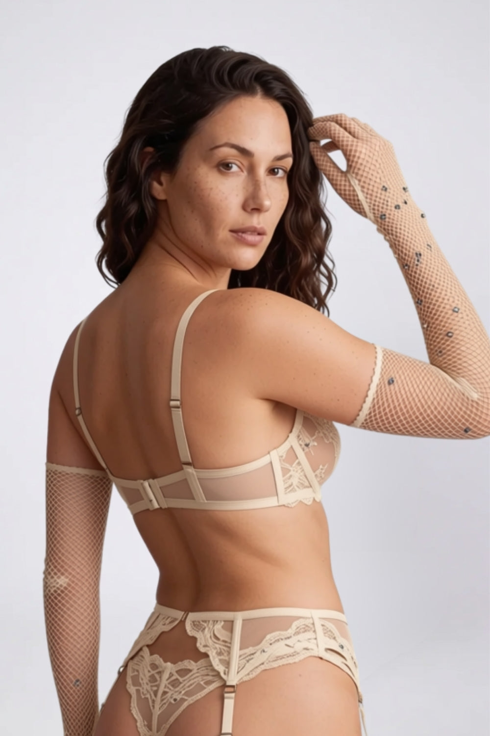 Model wearing rhinestone fishnet gloves in nude, alternate view