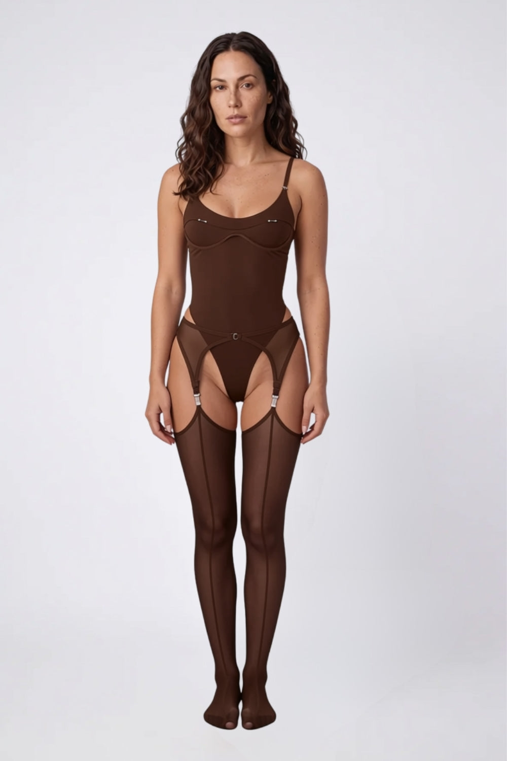 Model wearing satin-look mesh with garter straps bodysuit set in brown