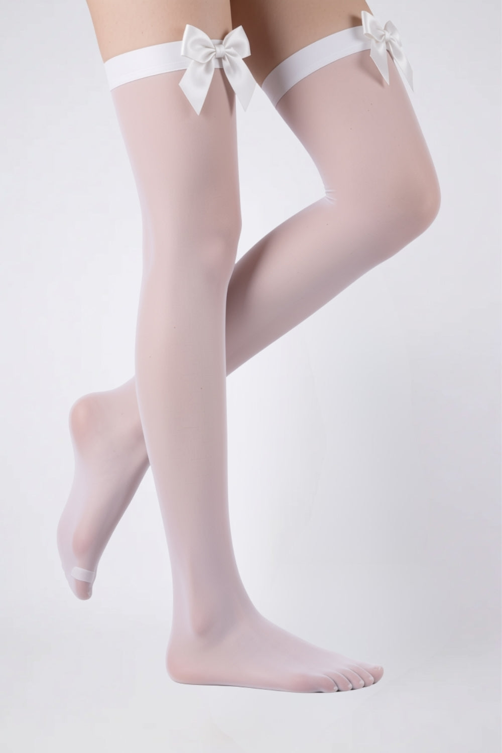 Model wearing sheer bow finish thigh-high stockings in white, alternate view