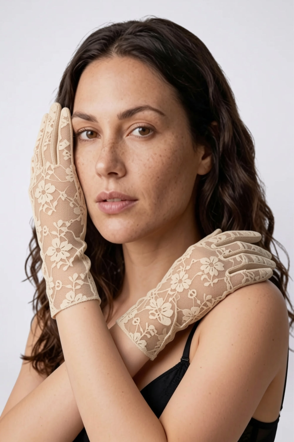 Model wearing sheer floral lace gloves in nude, alternate view