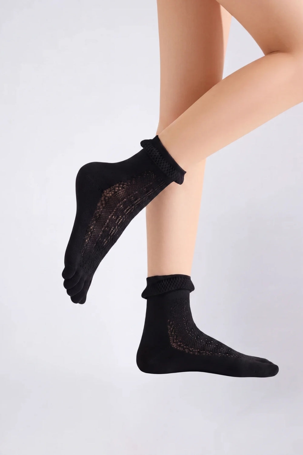Model wearing sheer lace five-toe stockings in black, alternate view