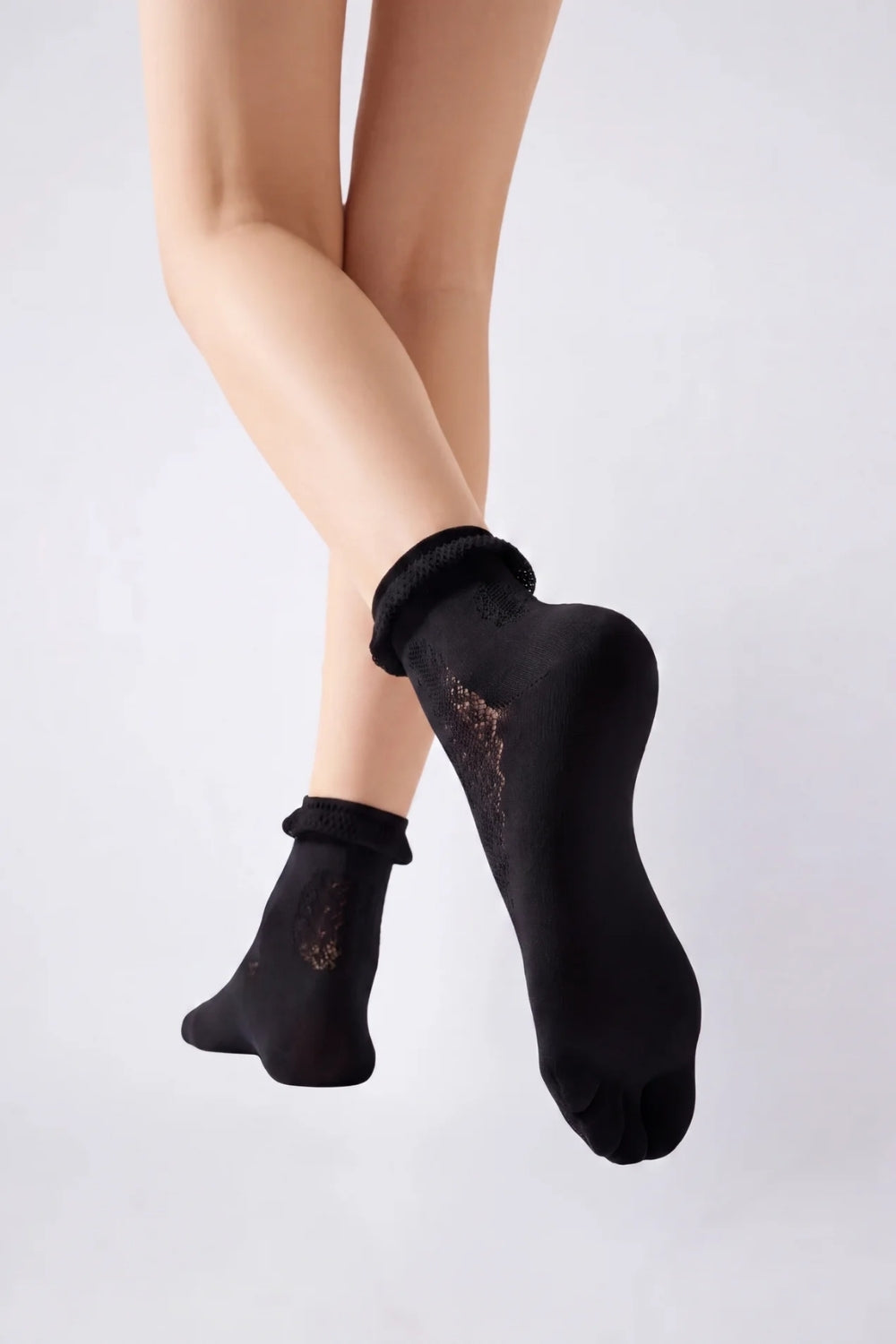 Model wearing sheer lace five-toe stockings in black, alternate view