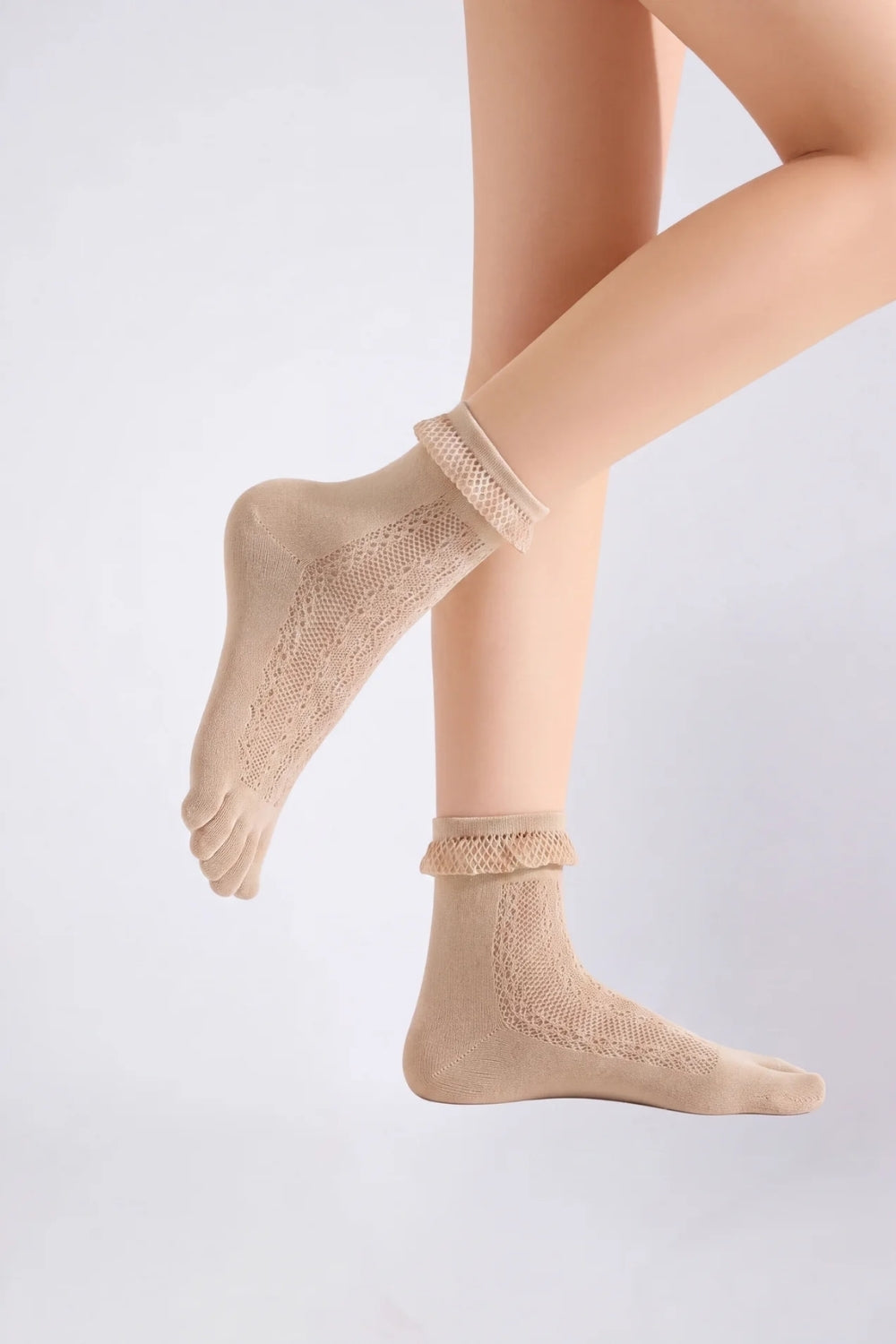 Model wearing sheer lace five-toe stockings in nude, alternate view