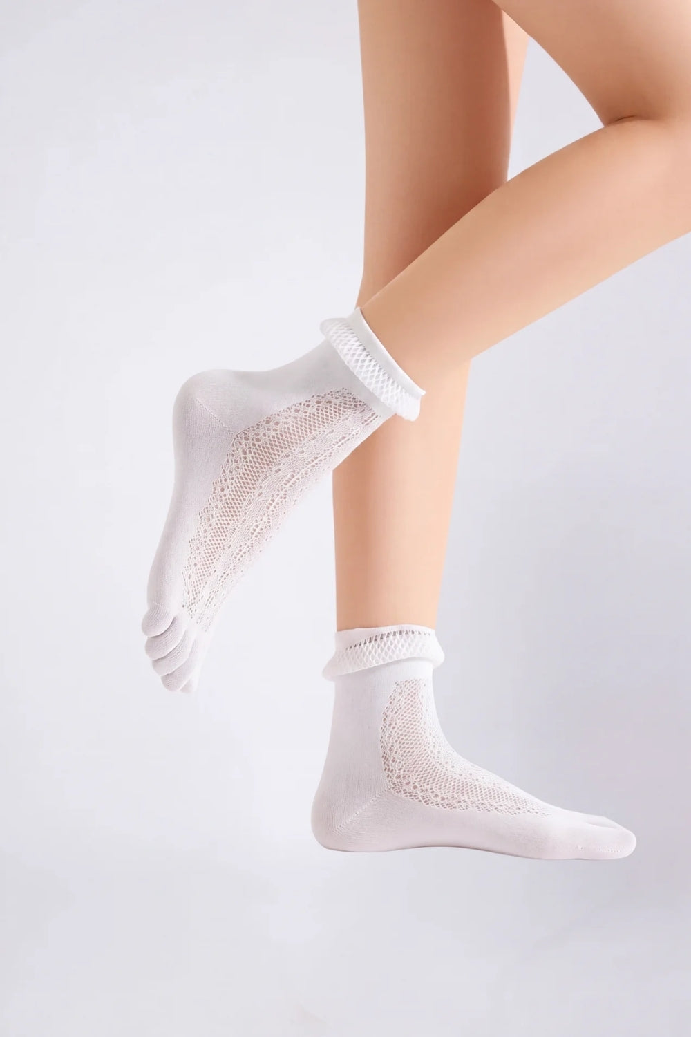 Model wearing sheer lace five-toe stockings in white, alternate view