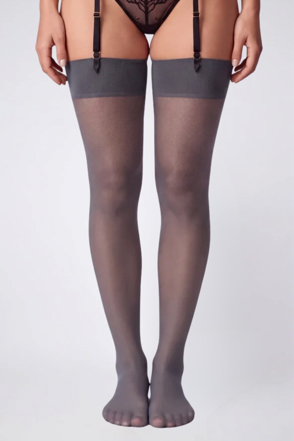 Model wearing sheer silky finish thigh-high stockings in grey
