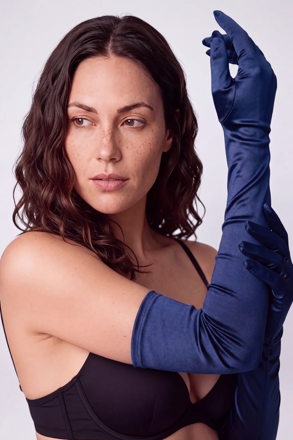 Model wearing silky opera length gloves in blue