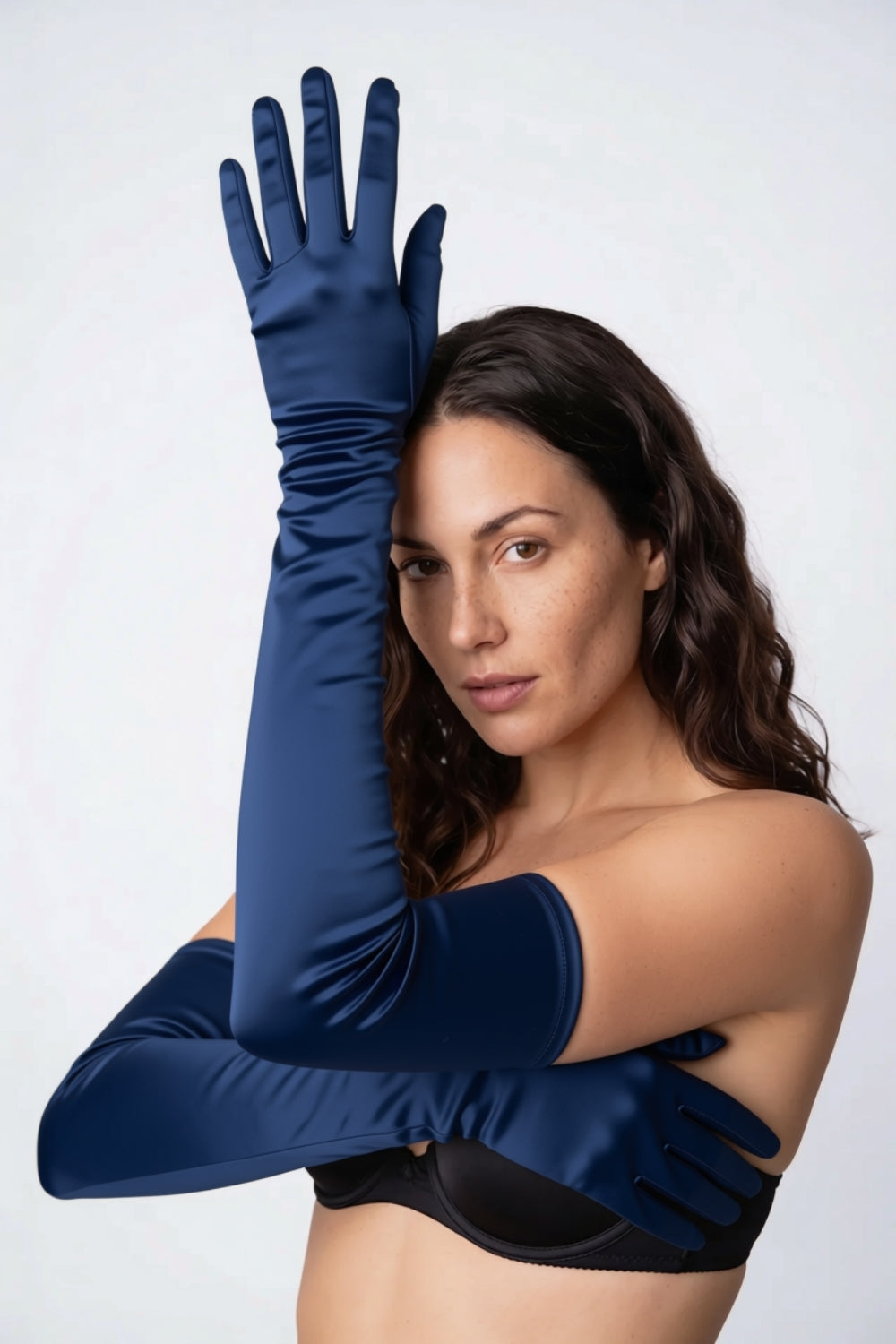Model wearing silky opera length gloves in blue, alternate view