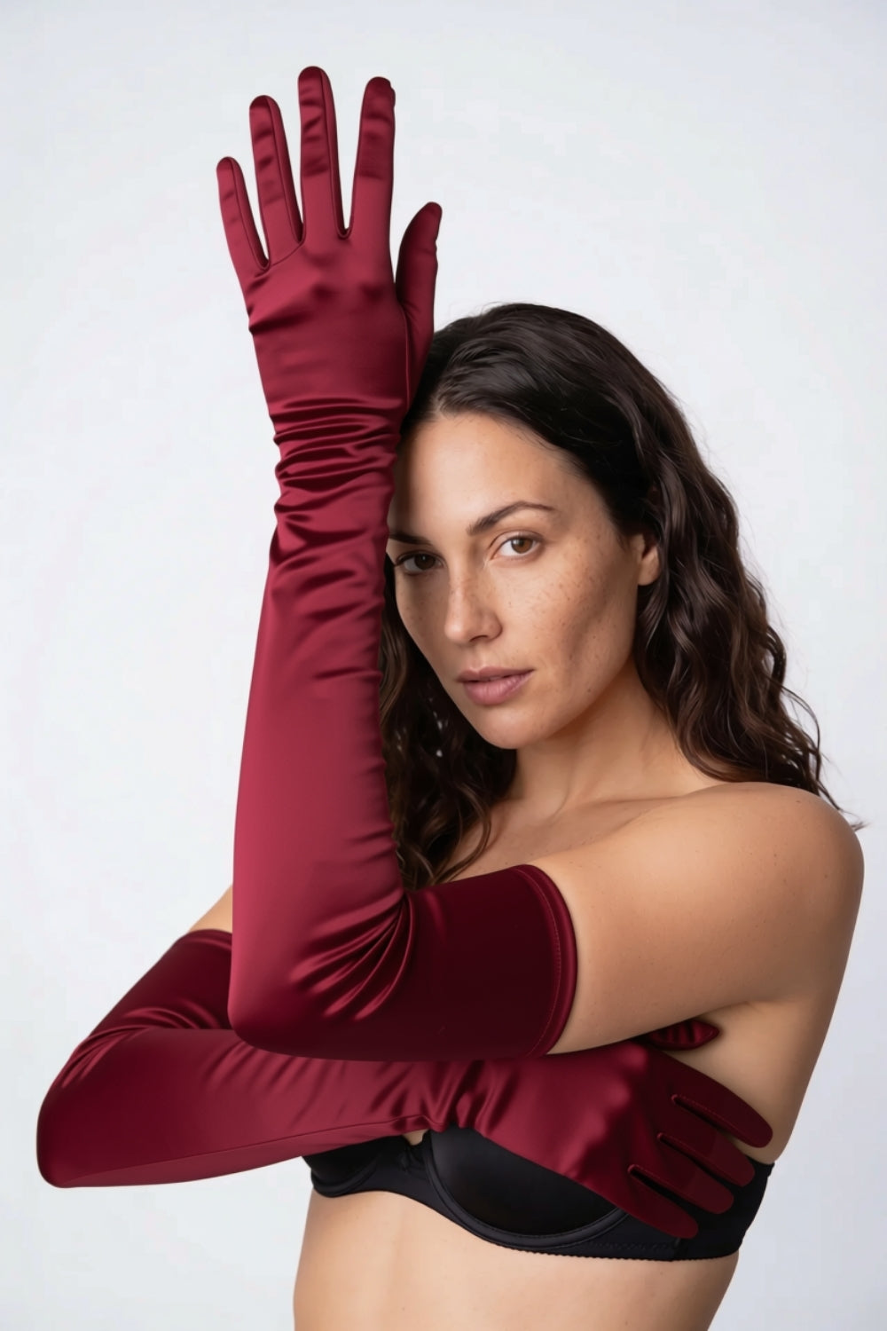Model wearing silky opera length gloves in red, alternate view