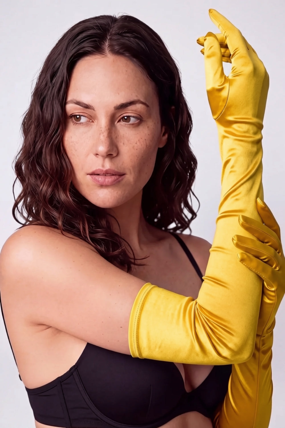 Model wearing silky opera length gloves in yellow