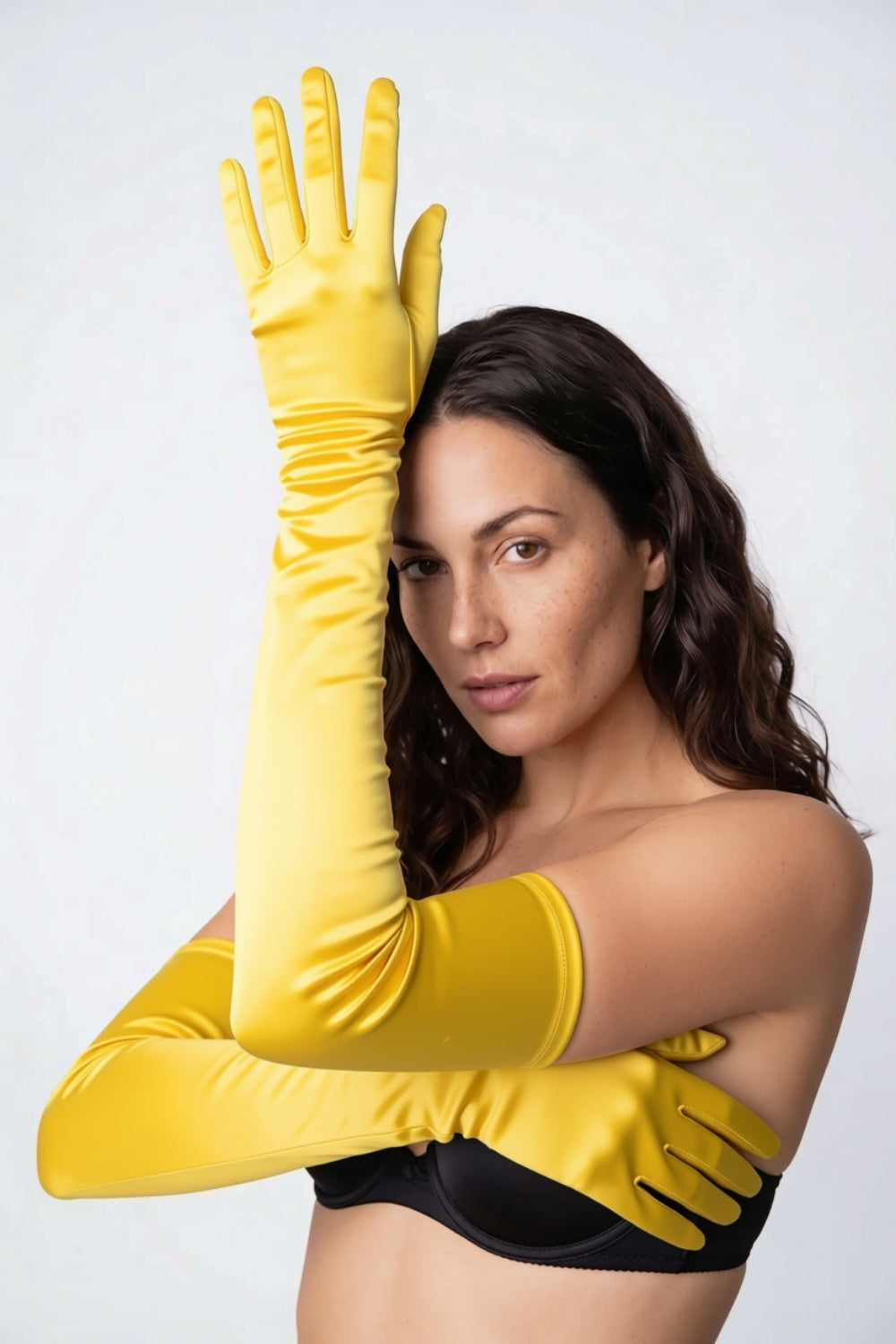 Model wearing silky opera length gloves in yellow, alternate view