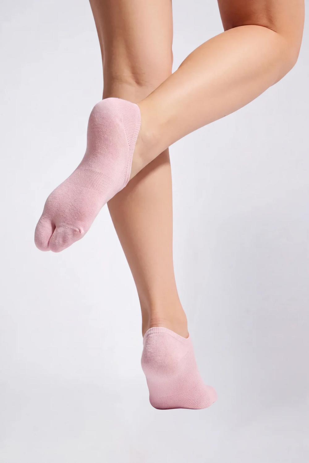 Model wearing split-toe no-show stockings in pink, alternate view