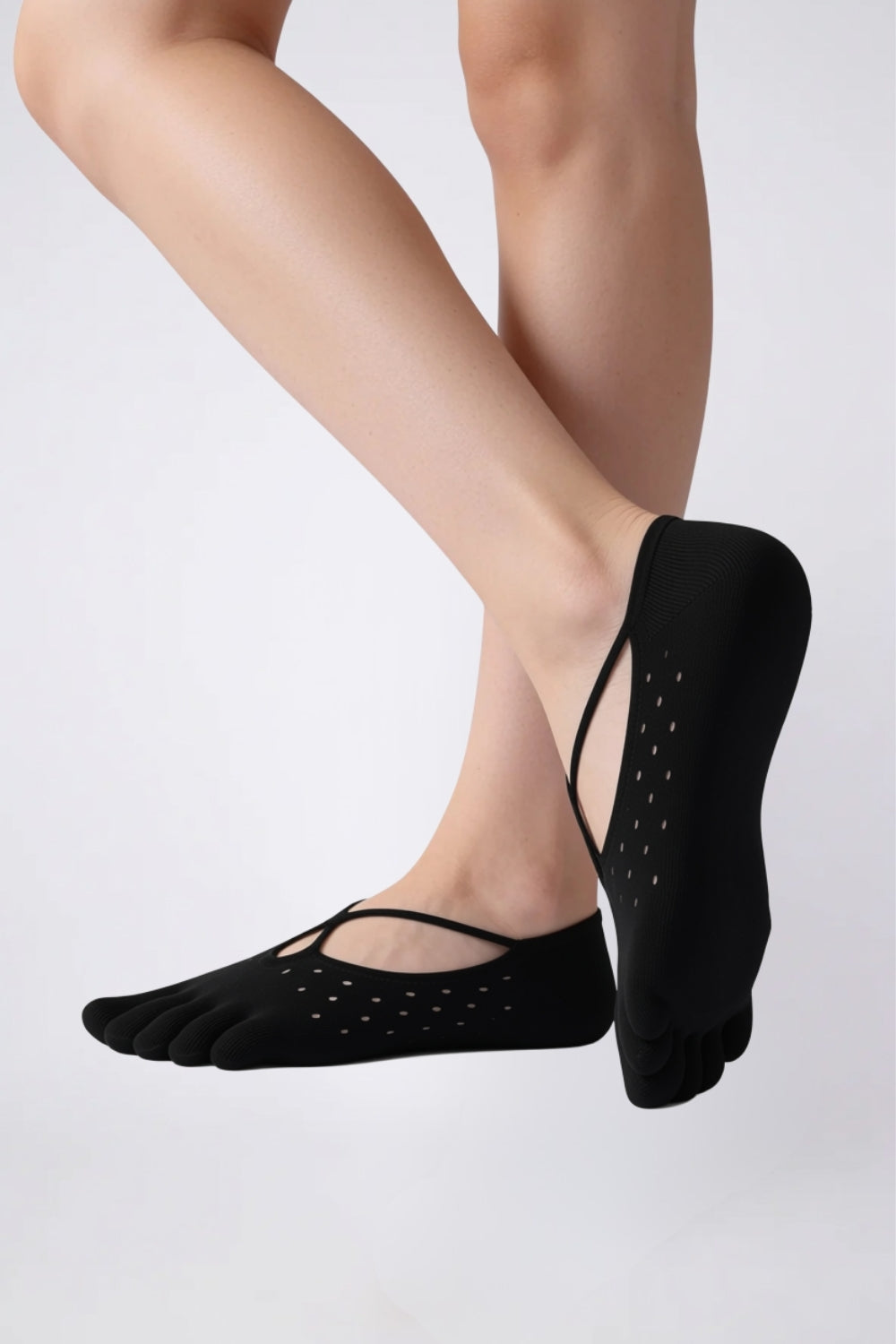 Model wearing strappy five-toe no-show stockings in black, alternate view