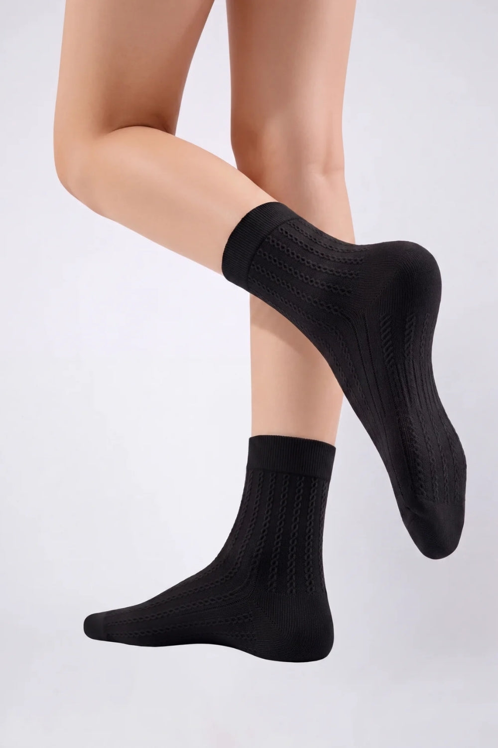 Model wearing textured ultra-thin ankle stockings in black, alternate view
