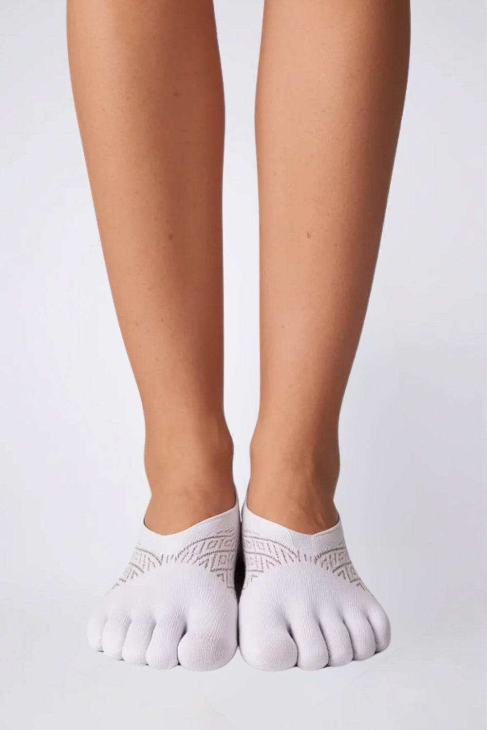 Model wearing toe design no-show stockings in white