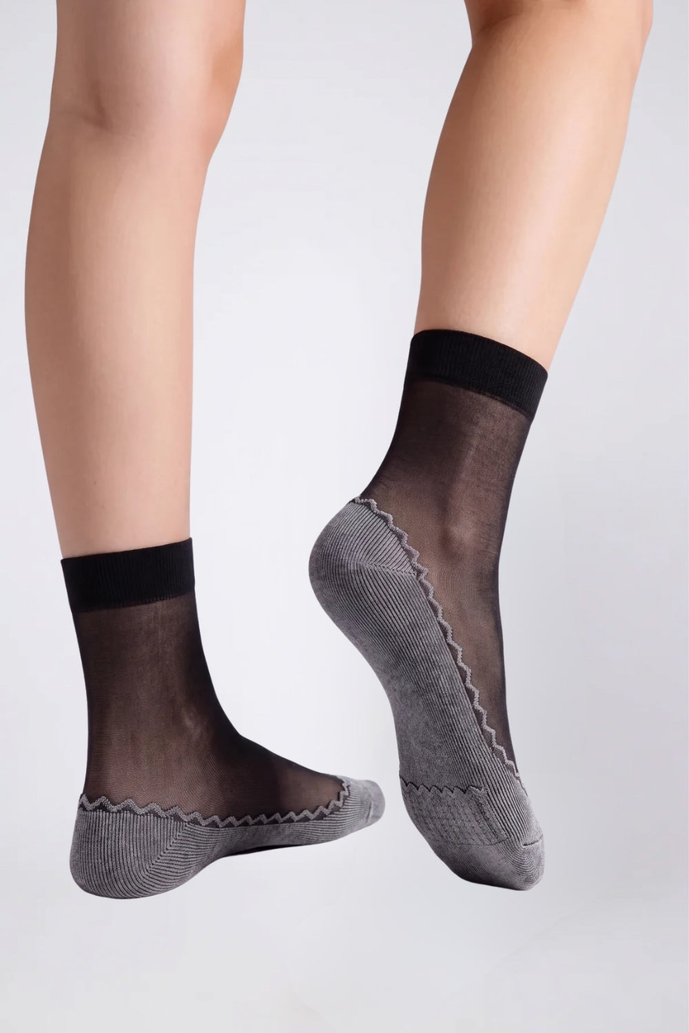 Model wearing ultra-thin sheer cotton sole stockings in black, alternate view