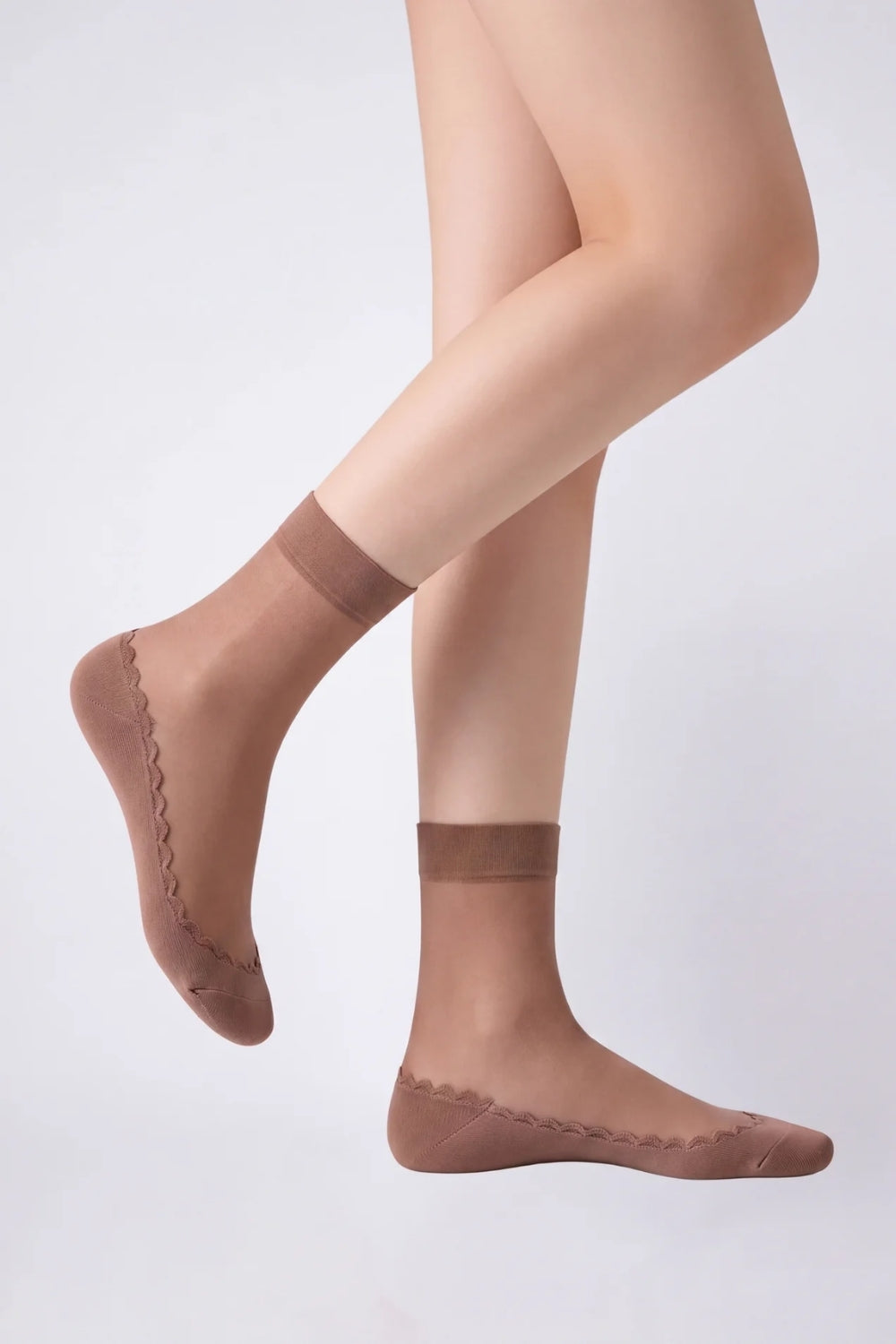Model wearing ultra-thin sheer cotton sole stockings in brown, alternate view