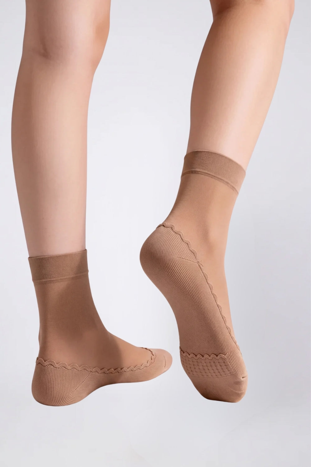 Model wearing ultra-thin sheer cotton sole stockings in brown, alternate view