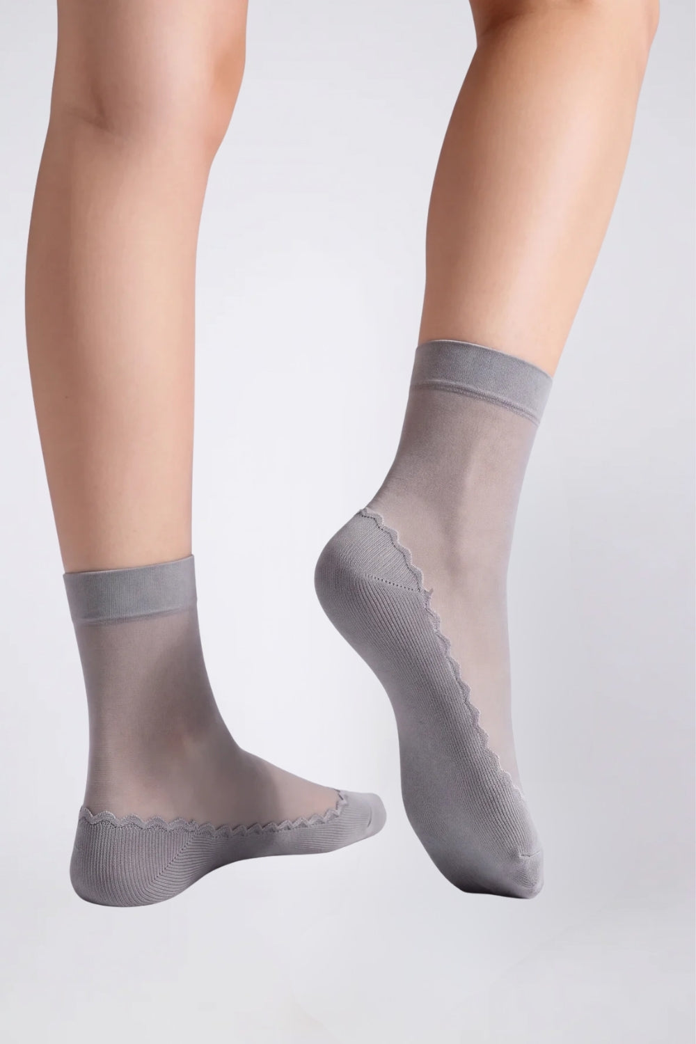 Model wearing ultra-thin sheer cotton sole stockings in grey, alternate view